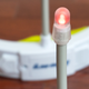 In addition to an audible buzz, a light atop each headband indicates when a play has moved too fast.
